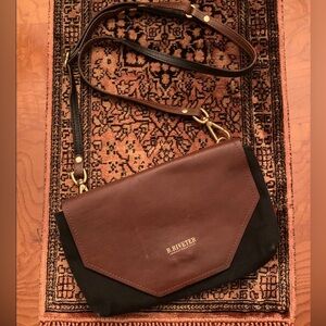 R Riveter Adjustable strap. Stained inside of the inner pocket-pictured.